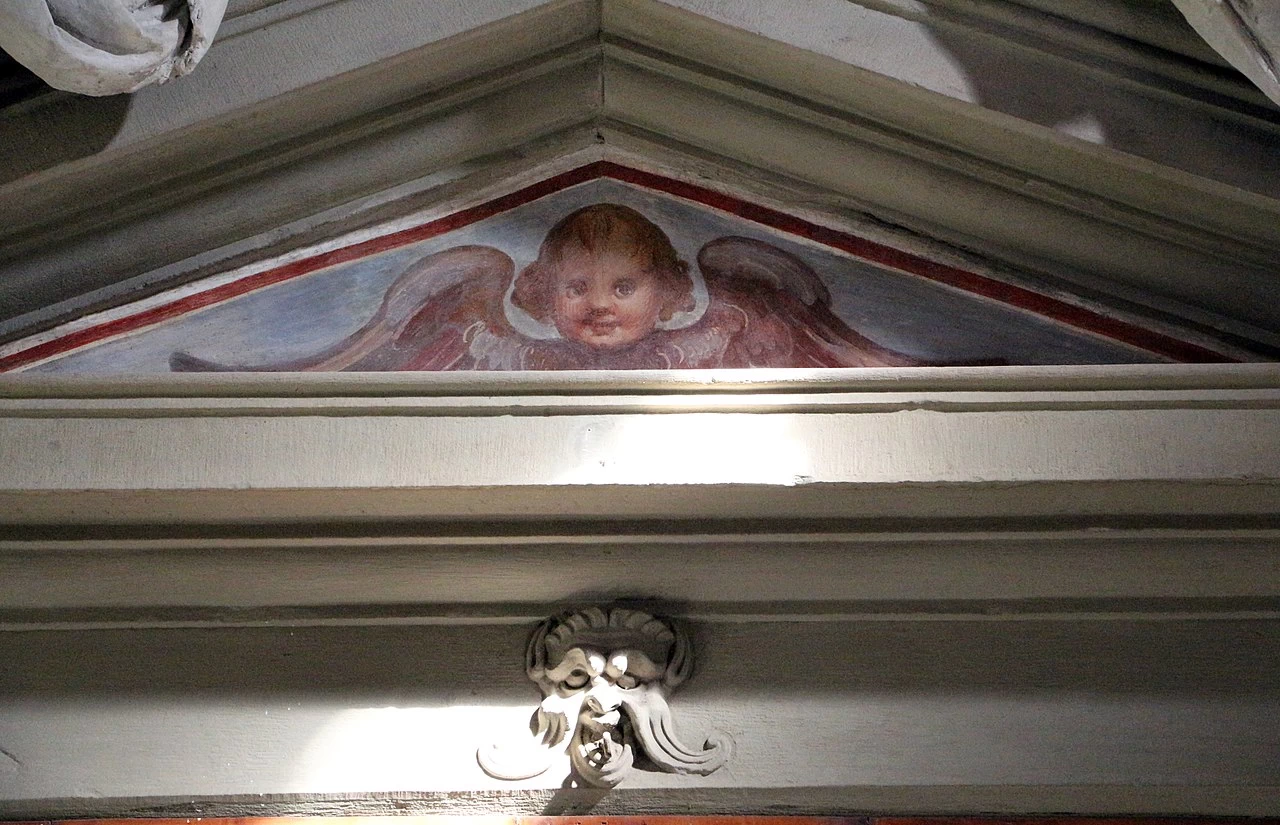 Santa Maria Nuova (Florence) - Cappella della Corsia maschile, cherubino e mascherone